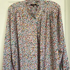 NYDJ very pretty blouse with a delicate ruffled neck.